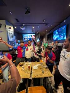 Barcelona fans celebrate with Real Madrid fans after 2025 Copa del Rey soccer match at Lion Sports Bar best soccer bar Philly World Cup 2026 Philadelphia center city sports bar football
