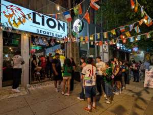A crowd waits outside Lion Sports Bar to get in to watch the FIFA World Cup best soccer bar Philly number one soccer bar Philadelphia